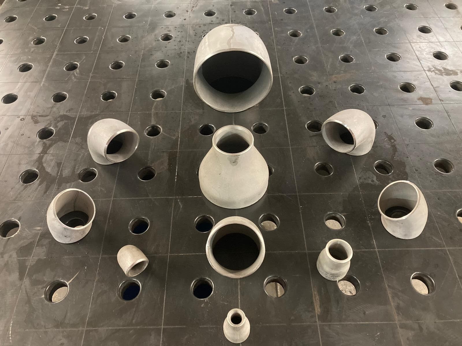 An assortment of SCH10s Stainless Steel pipe fittings
